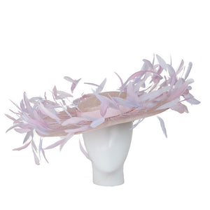 women's kentucky derby hat. Pink feathered hat on a mannequin head against a white background