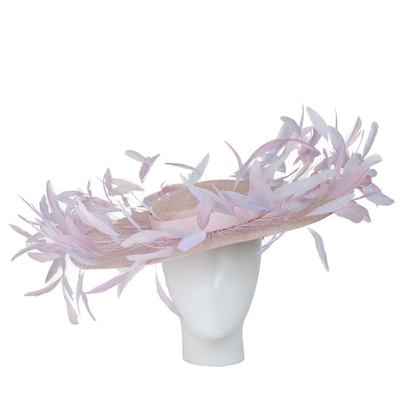 women's kentucky derby hat. Pink feathered hat on a mannequin head against a white background