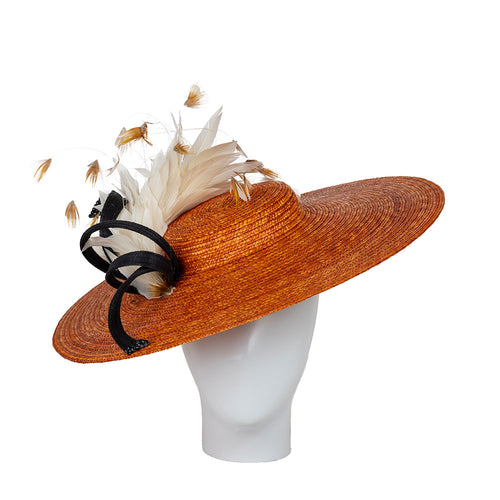 Designer summer hat with decorative feathers  and black ribbon on a white background