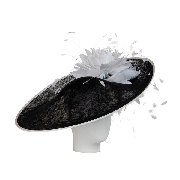 A luxury ladies derby hat in black and white, adorned with feathers.