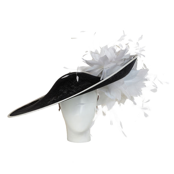 A black and white ladies derby hat, a luxury black hat adorned with white feathers