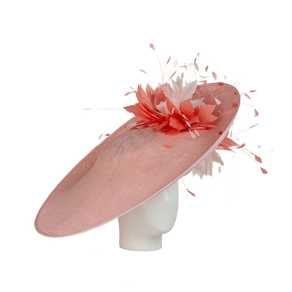 a light pink derby hat with feather embellishments in coral and shades of pink