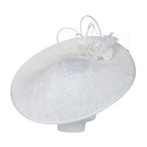 White decorative hat with lace details on a white background
