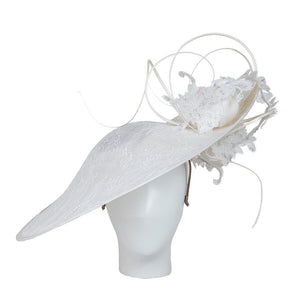 Luxury hats . A white decorative hat on a mannequin head against a white background